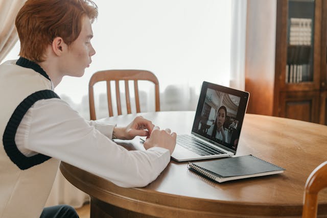 Online student receiving academic support from student councellor via video call