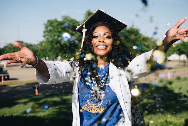 health management graduate throwing confetti