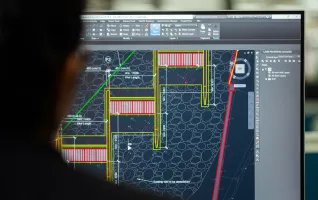 Civil engineer designs lightweight structures on computer screen