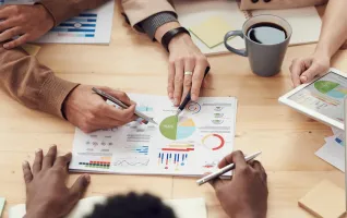 team discussing financial documents in a meeting